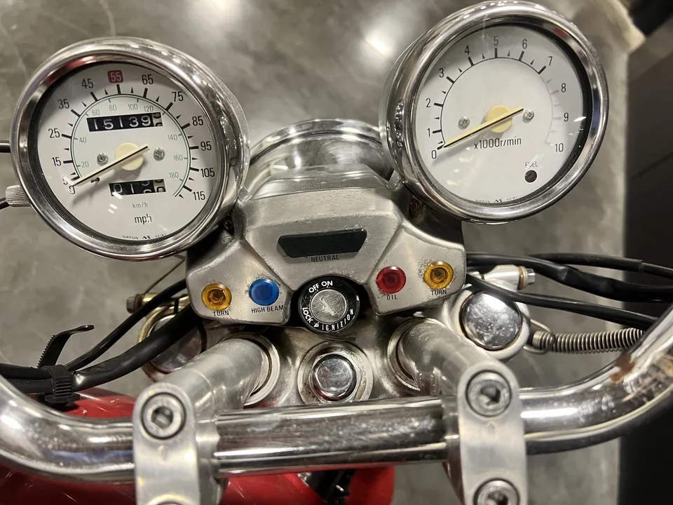 Big Red's original chrome gauges and switchgear, seen from the rider's seat.