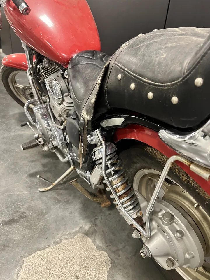 The studded leather seat and rear fender of Big Red, the Virago 1100.